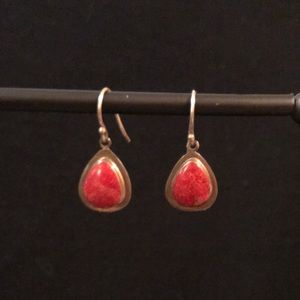 Red stone in silver earrings